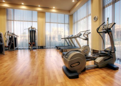 gym-room-luxury-resort-in-united-arab-emirates-with-white-window-curtains-plus-light-brown-laminate-flooring-tile